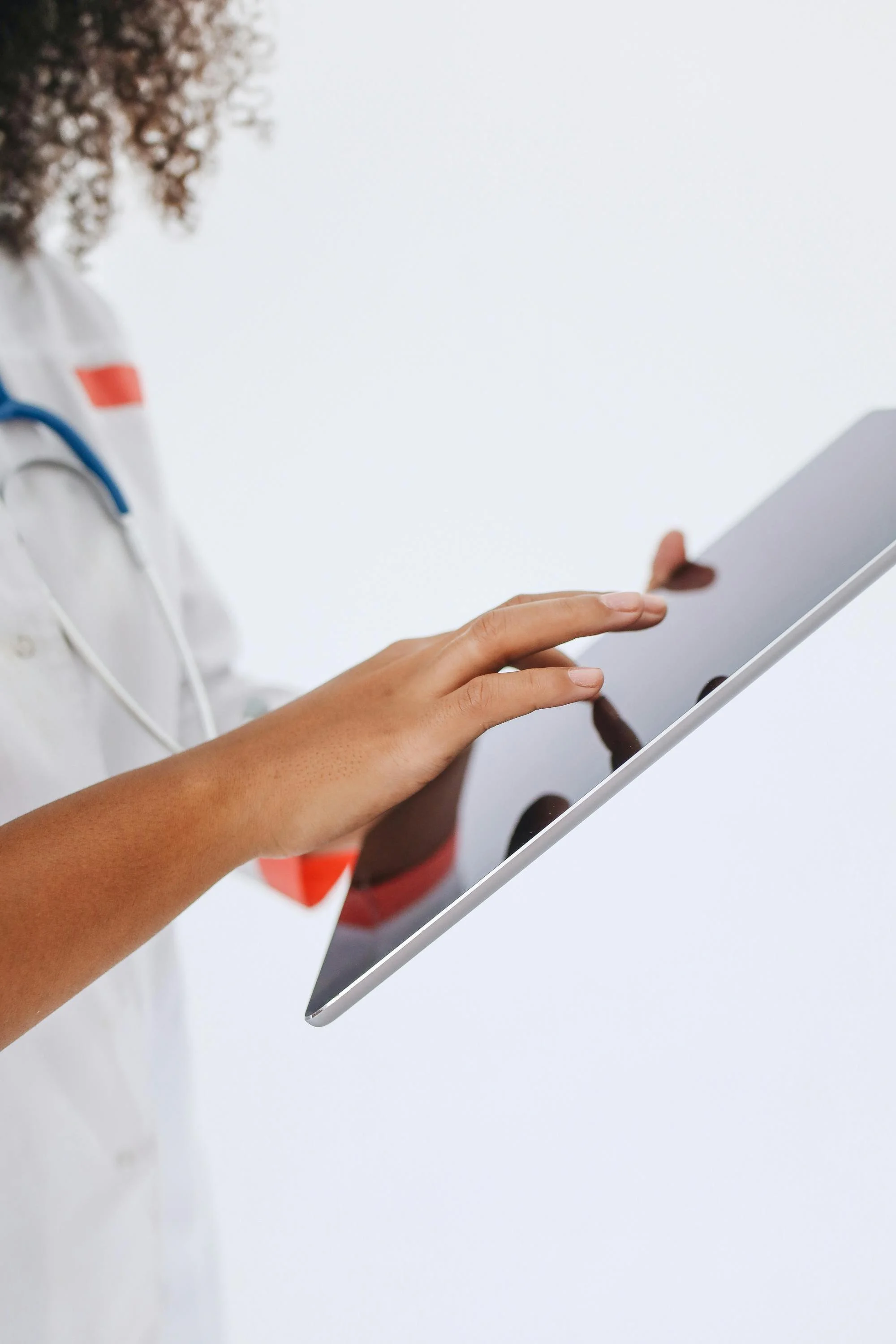 Clinician working on a tablet
